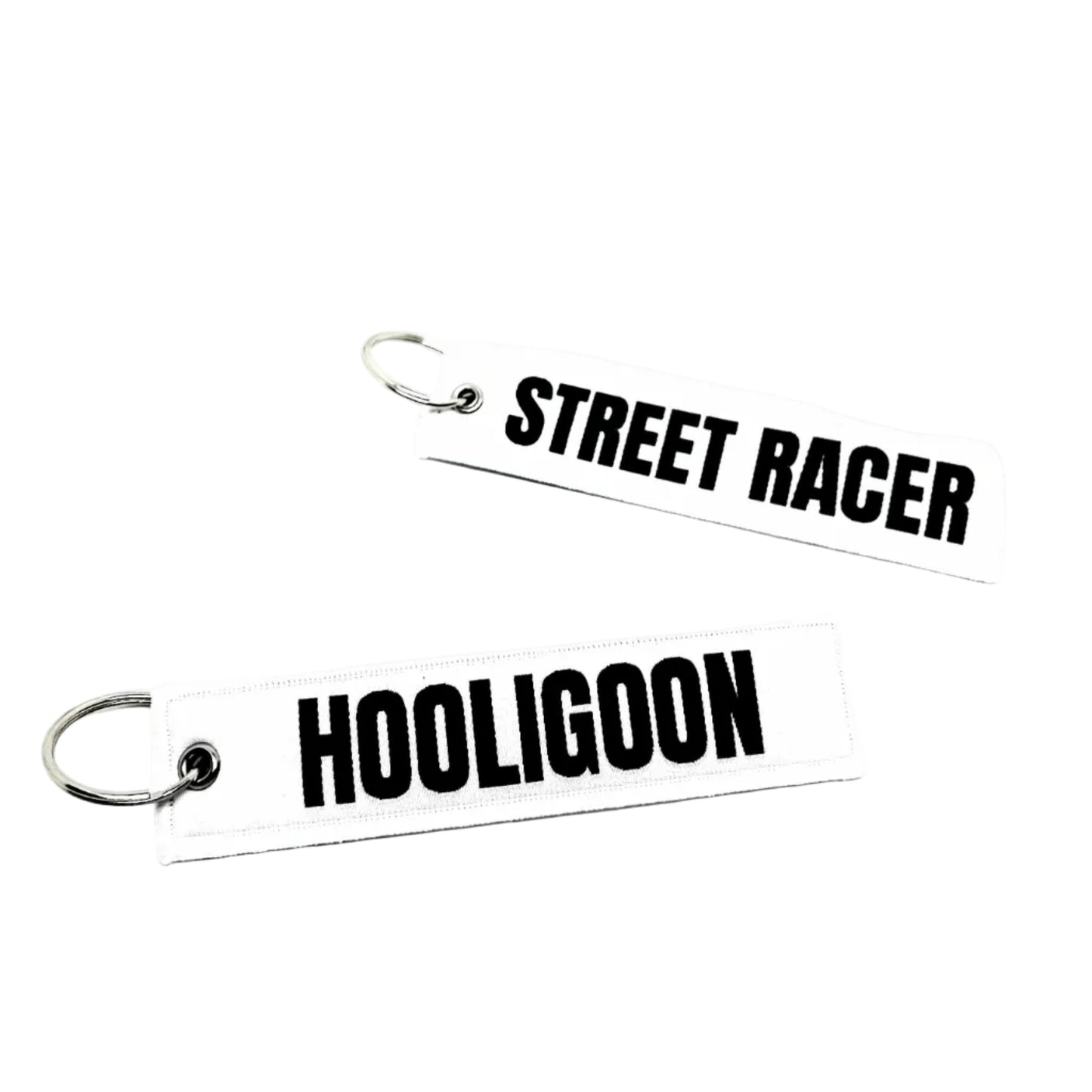 Two keychains with 'Street Racer' and 'Hooligano' text on a white background