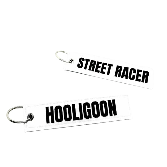 Two keychains with 'Street Racer' and 'Hooligano' text on a white background