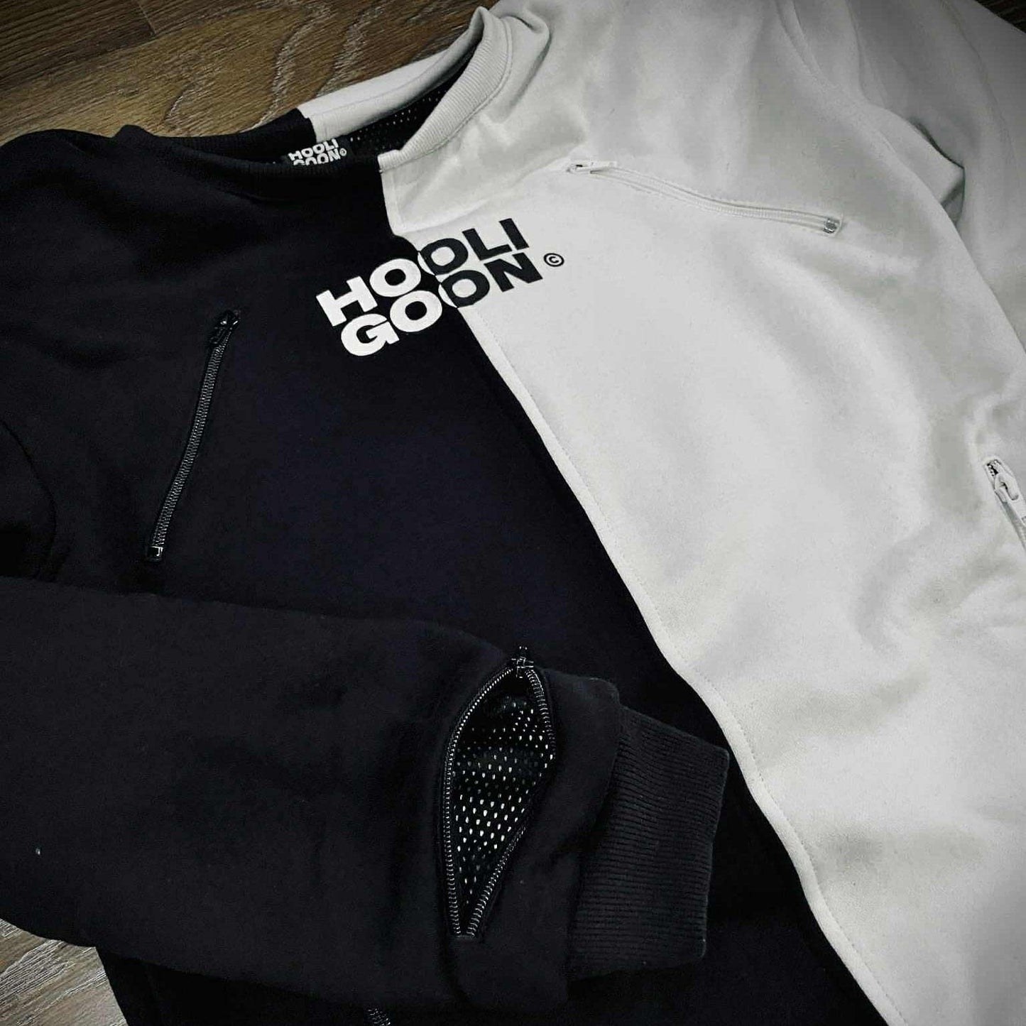 Black and white tee with text on a wooden surface