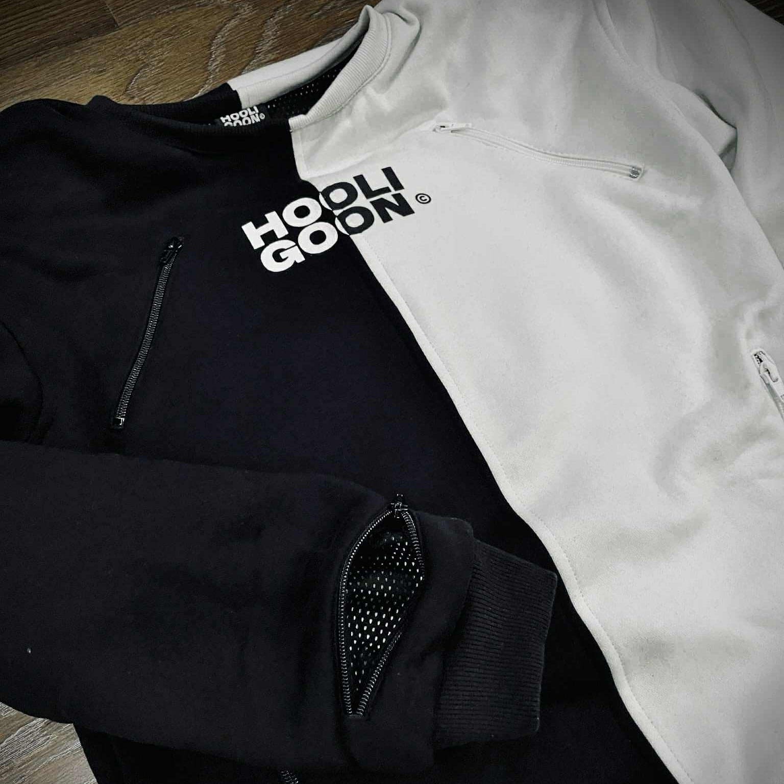 Black and white tee with text on a wooden surface