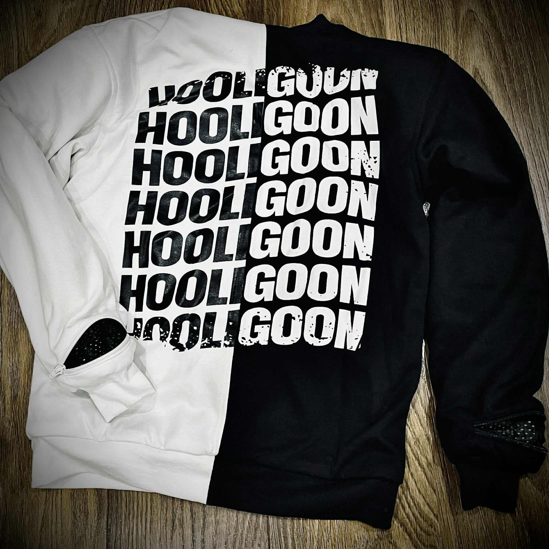 Black and white tee with 'HOOLIGOON' text on a wooden surface