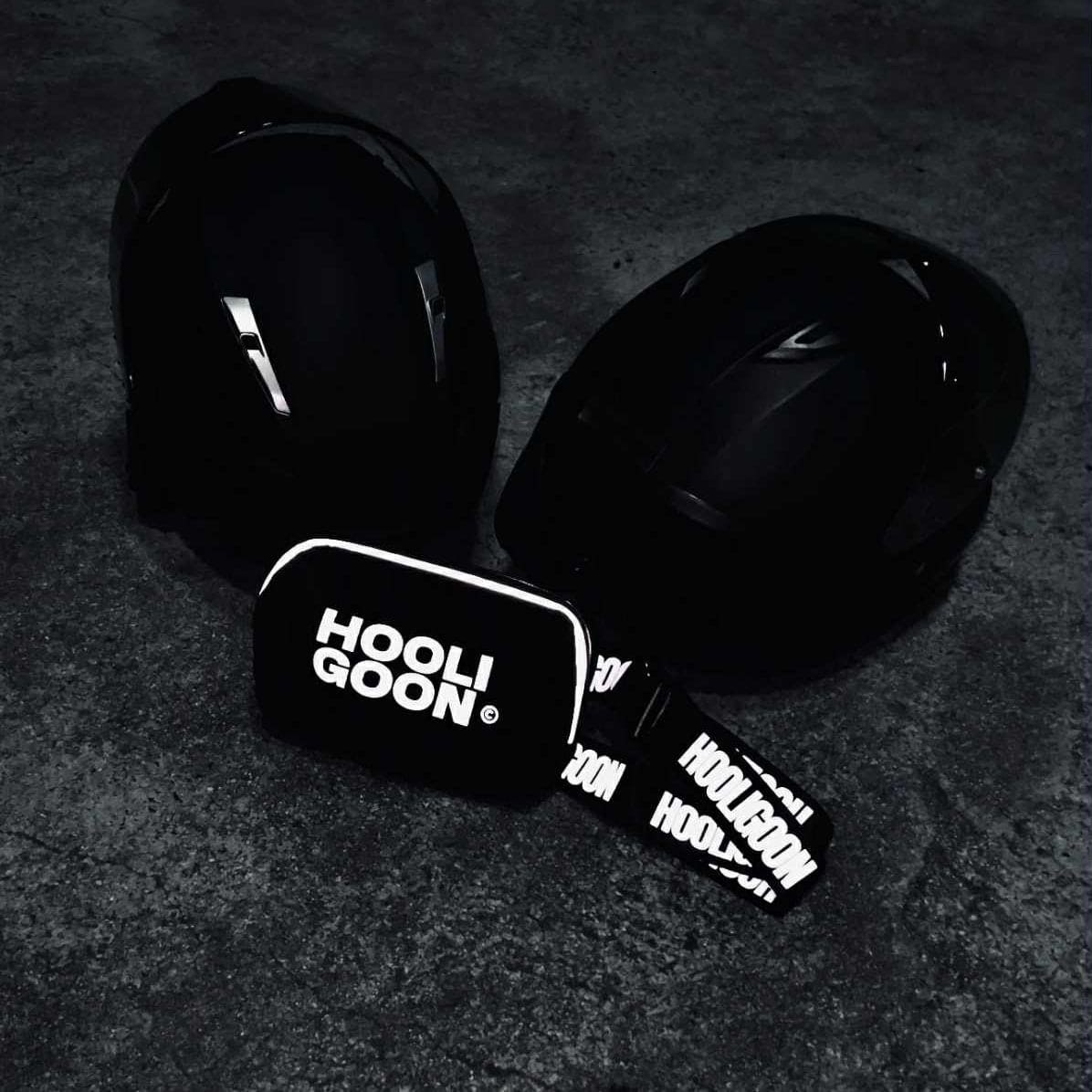 Black bag with 'HOOLIGOON' branding on a dark textured background