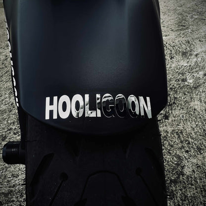 Black fender with 'Hooligoon' branding on a textured surface