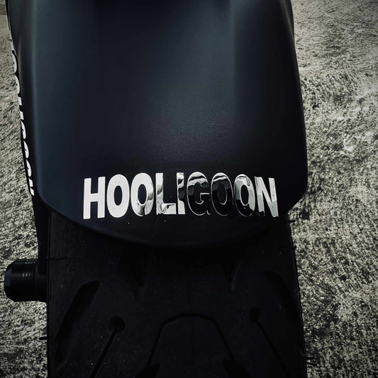 Black fender with 'Hooligoon' branding on a textured surface