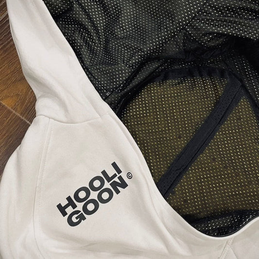 White hoodie with 'Hooligoon' text on a wooden floor