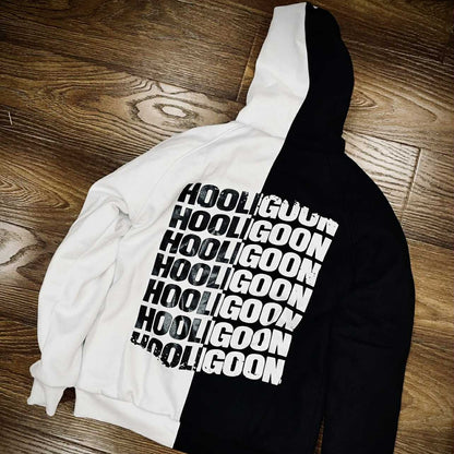 Black and white hoodie with 'Hooligoon' text on a wooden floor