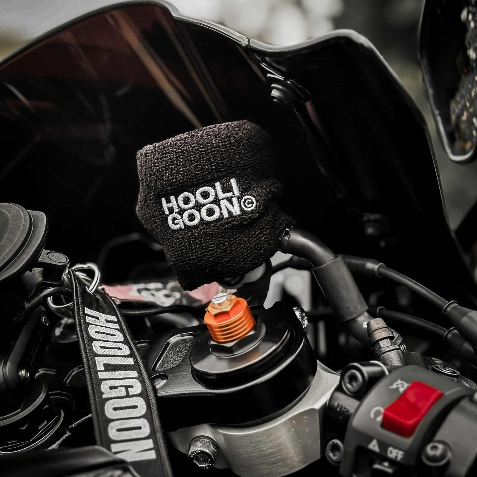 Motorcycle with 'HOOLIGOON' branded brake reservoir cover