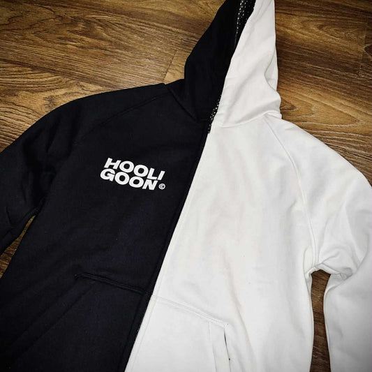 Black and white hoodie with 'Hooligoon' text on a wooden floor