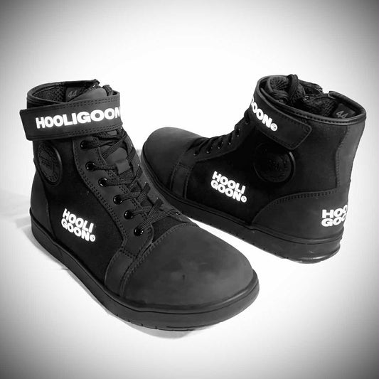 Black high-top sneakers with 'Hooligoon' branding on a gray background